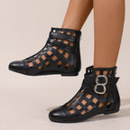 Women's round toe cutout ankle boots by Trendsi with stylish design, low heel, and comfortable fit, perfect for casual or dressy outfits.