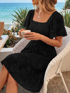 Women's smocked tiered square neck short sleeve casual dress with pockets, featuring a flowy design and comfortable fit.