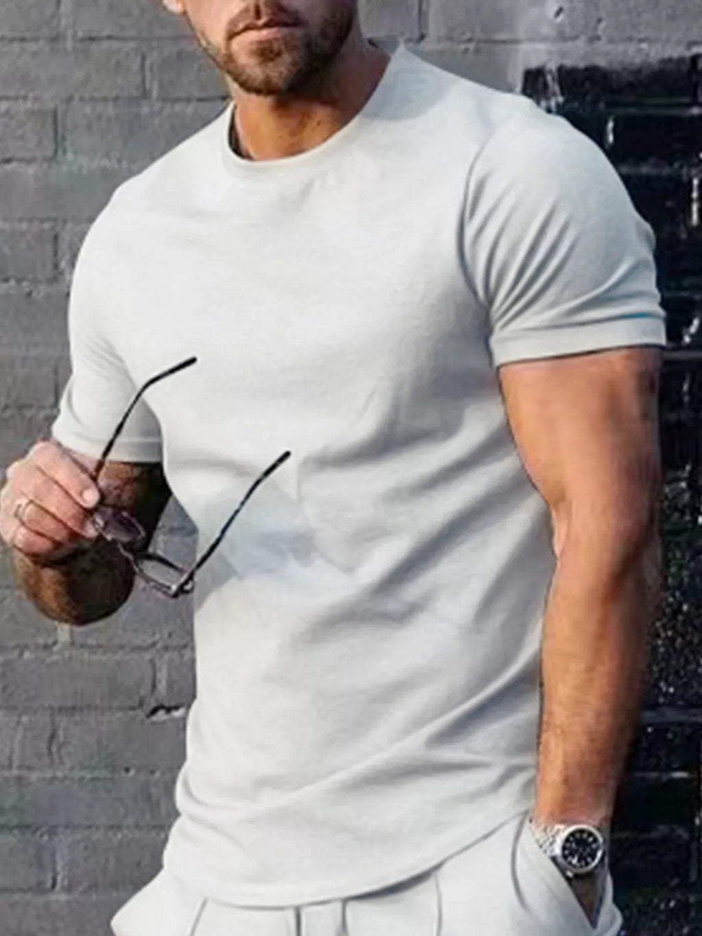 Men's plus size solid color casual T-shirt by Trendsi, showing a relaxed fit and comfortable fabric in a neutral shade.