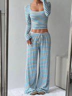 Striped long sleeve crop top and wide-leg pants set from Trendsi, featuring a stylish matching clothing ensemble.