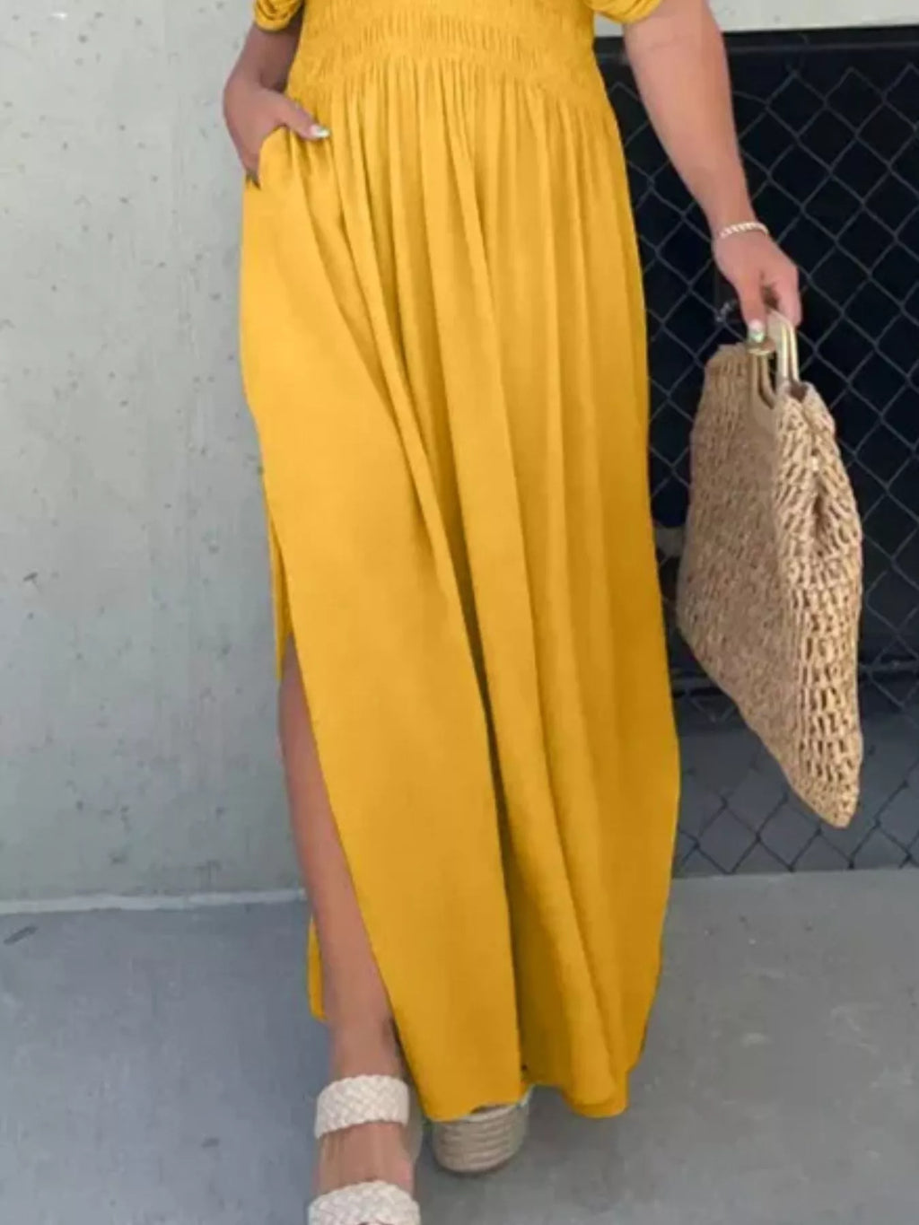 Full size slit V-neck smocked waist maxi dress by Trendsi, plus size, shown with flowing fabric and elegant design.