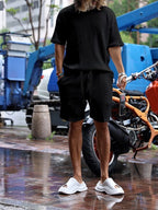 Plus size men's short sleeve top and shorts set by Trendsi, featuring a casual, comfortable fit with a coordinated design.
