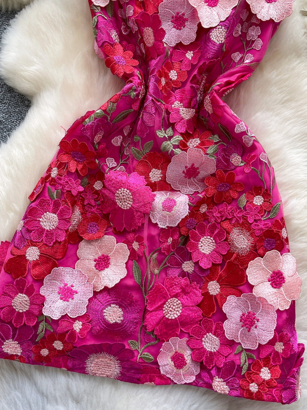 Floral embroidered tie waist mini dress by Trendsi featuring an elegant summer A-line silhouette with colorful floral embroidery.