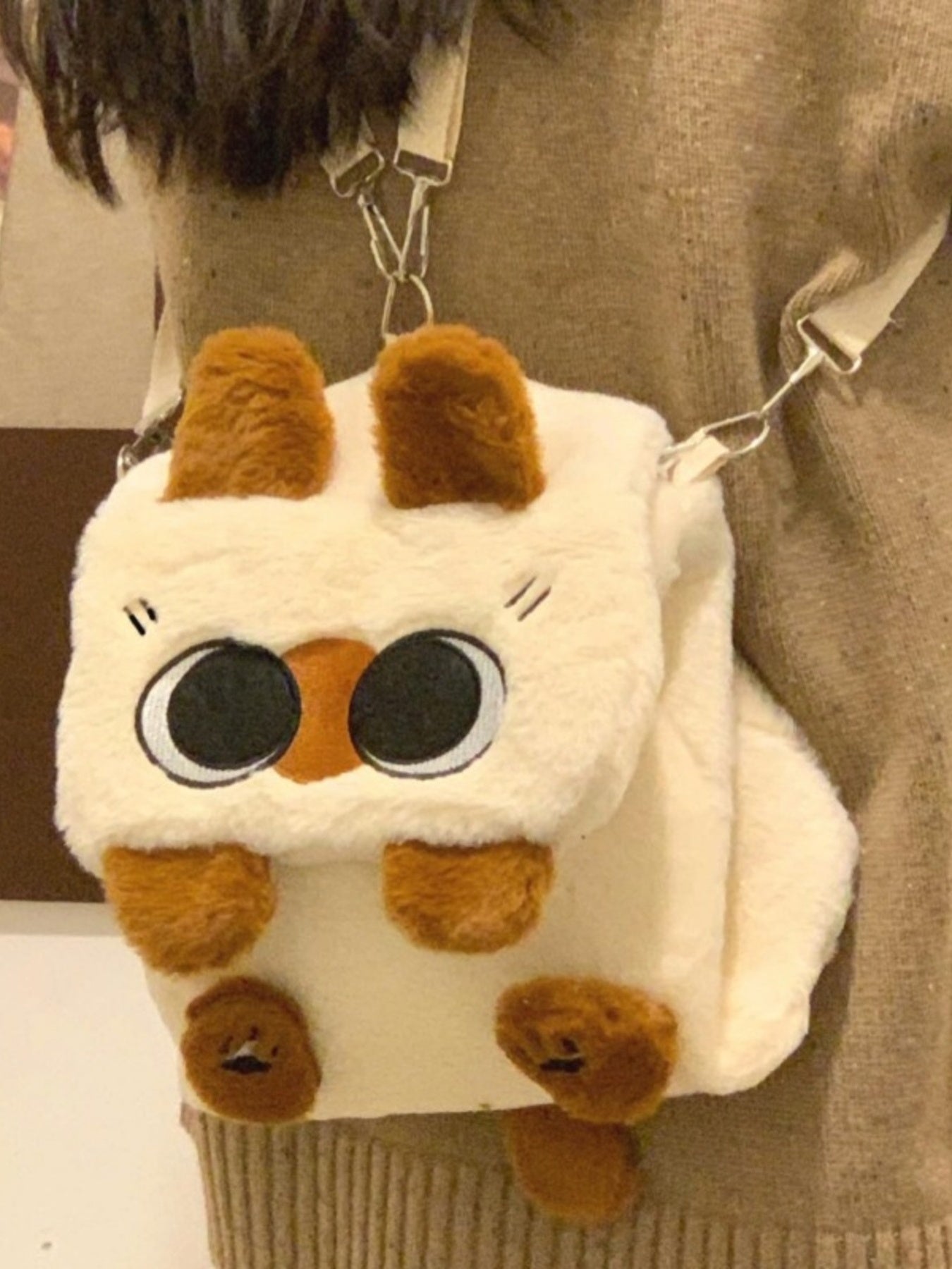 Soft woolen plush cat mini backpack from Trendsi featuring whimsical design and adorable cat face, perfect for cute accessory.