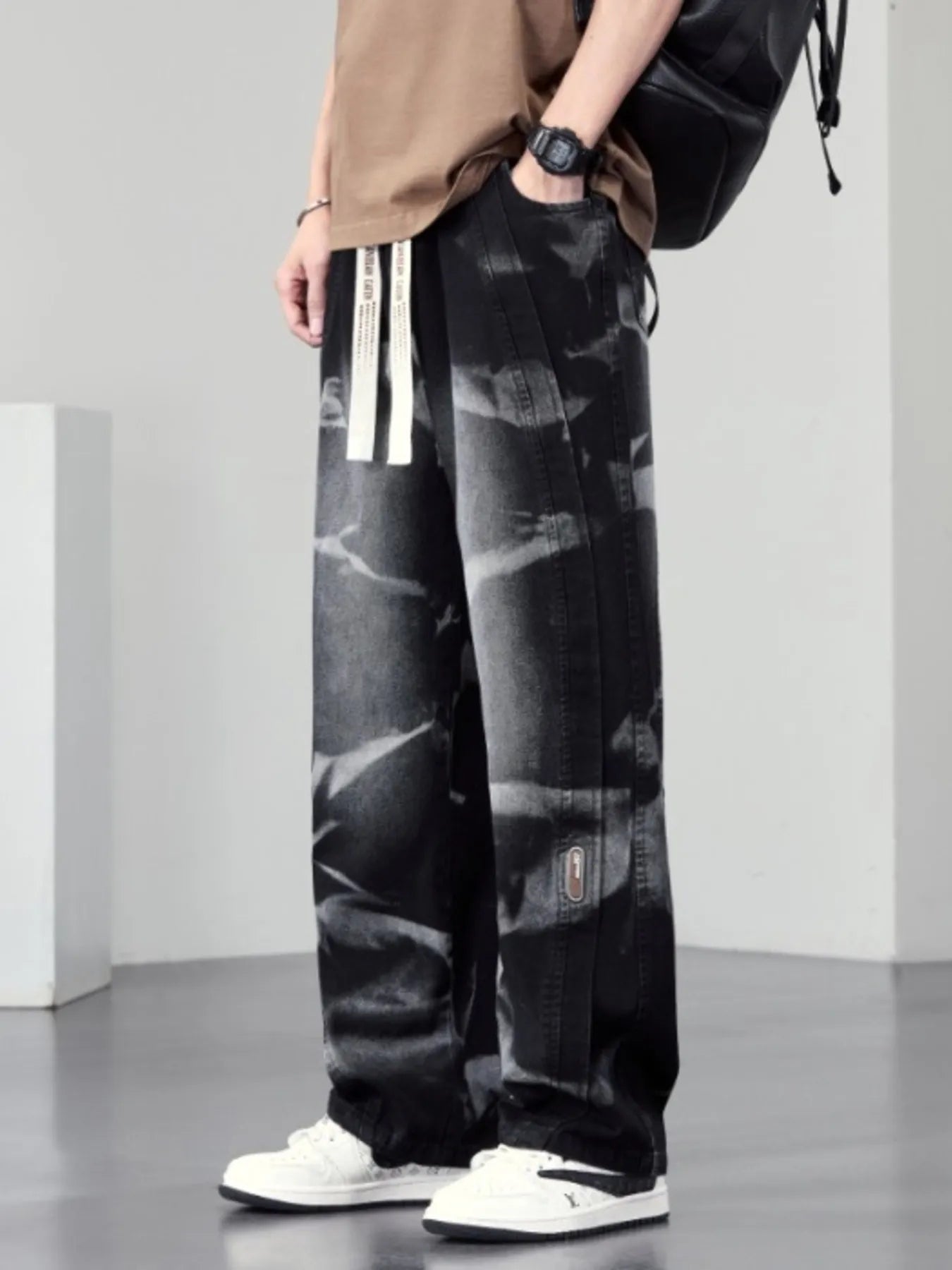 Men's plus size washed wide-leg jeans by Trendsi, featuring relaxed fit and distressed denim, displayed on a plain background.