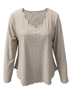 Elegant women's eyelet long sleeve blouse from Trendsi, featuring a versatile stretchy office top with eyelet detail and long sleeves.