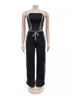 Trendsi sleeveless tube top and wide leg pants set, black fabric, casual fashion, front view showing fit and style.