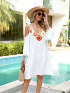 Crochet trim cold shoulder cover-up dress from Trendsi featuring a relaxed fit and stylish design, perfect for beachwear or summer outings.