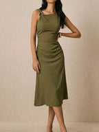 Asymmetrical neck ruched midi dress by Trendsi featuring a fitted silhouette and elegant draping, shown on a model.