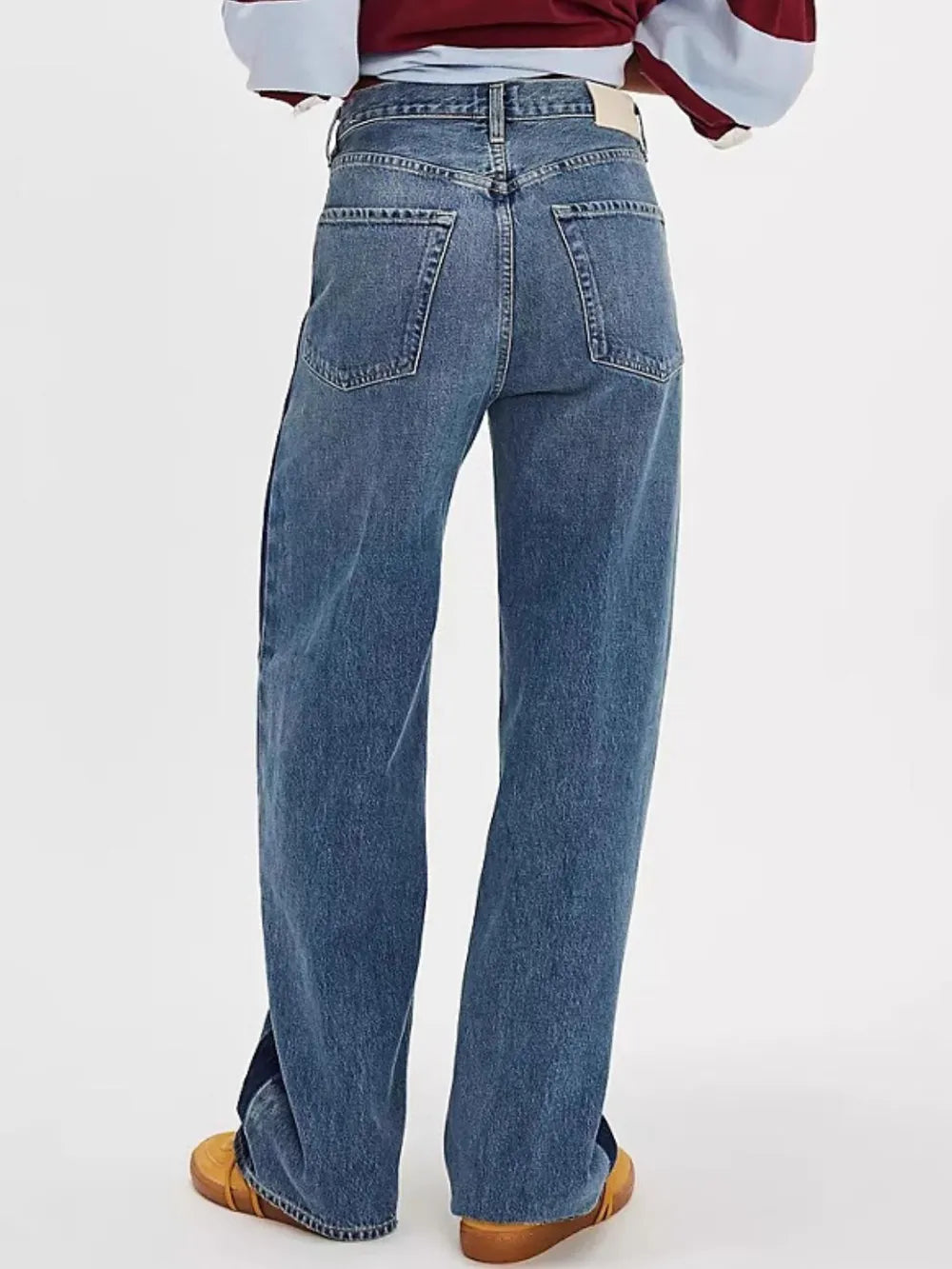 Plush Fashion Hub baggy denim jeans with multiple pockets, relaxed fit, and classic blue wash, displayed on a model.