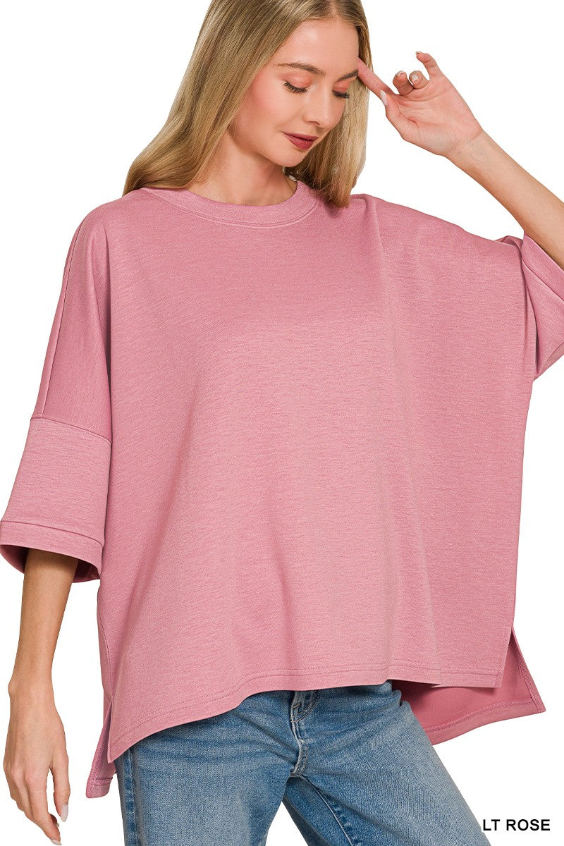 Women's scuba round neck top with side slits in a relaxed fit, featuring comfortable fabric and casual style.