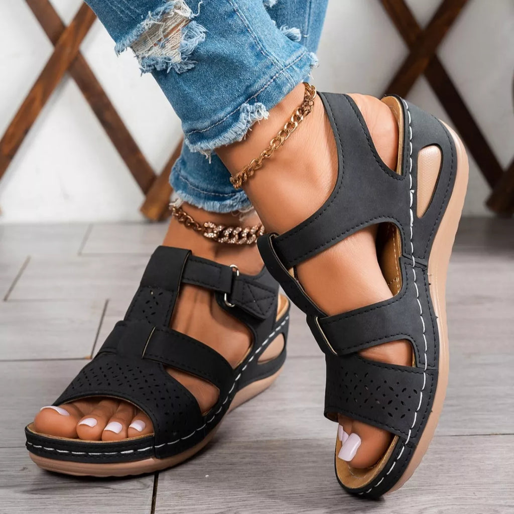 Open toe wedge sandals from Trendsi featuring a stylish design with a sturdy heel and comfortable footbed.