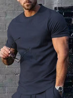 Men's plus size casual T-shirt in solid color from Trendsi, featuring a comfortable fit and classic design.