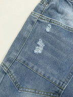 Distressed Plush Fashion Shop denim jeans with pockets, featuring a casual, ripped design and classic five-pocket style.
