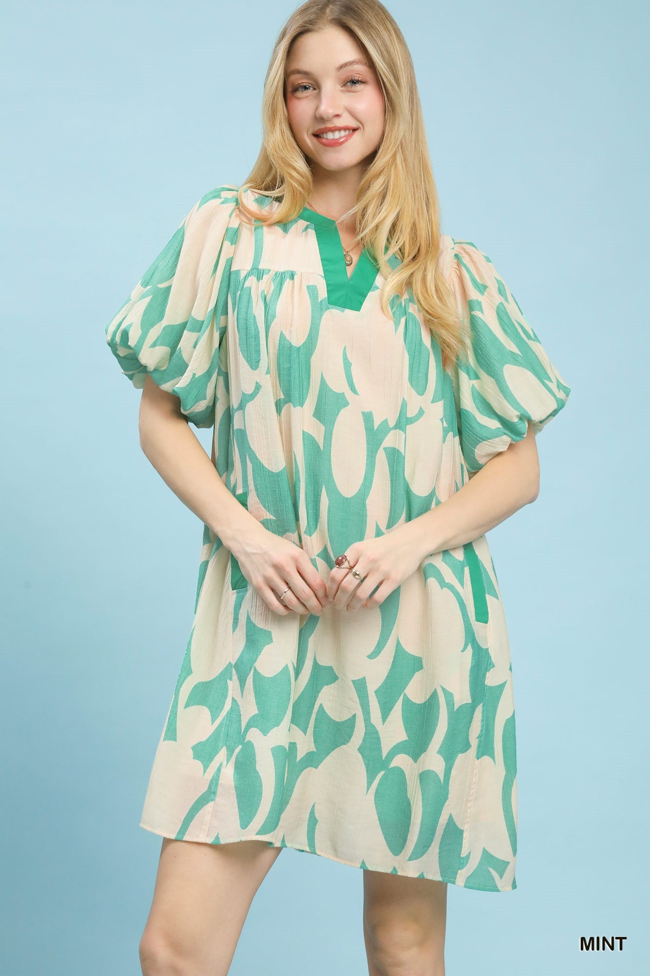 Mint green abstract print puff sleeve mini shift dress by Plush Fashion Hub, featuring a stylish design and comfortable fit.