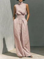 Trendsi sleeveless turtleneck top and wide-leg pants set, stylish and comfortable outfit, shown on a model against a neutral background.