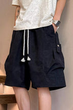 Plus size men's drawstring shorts with pockets from Trendsi, featuring a comfortable fit and casual style.
