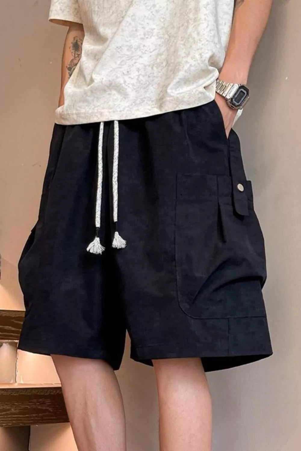 Plus size men's drawstring shorts with pockets from Trendsi, featuring a comfortable fit and casual style.