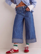 Plush Fashion Shop wide-leg cropped denim jeans displayed on a hanger, showcasing relaxed fit and stylish cut.