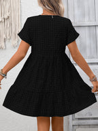 Lightweight plaid V-neck mini dress with ruffle hem from Trendsi, perfect for seasonal fashion and casual occasions.