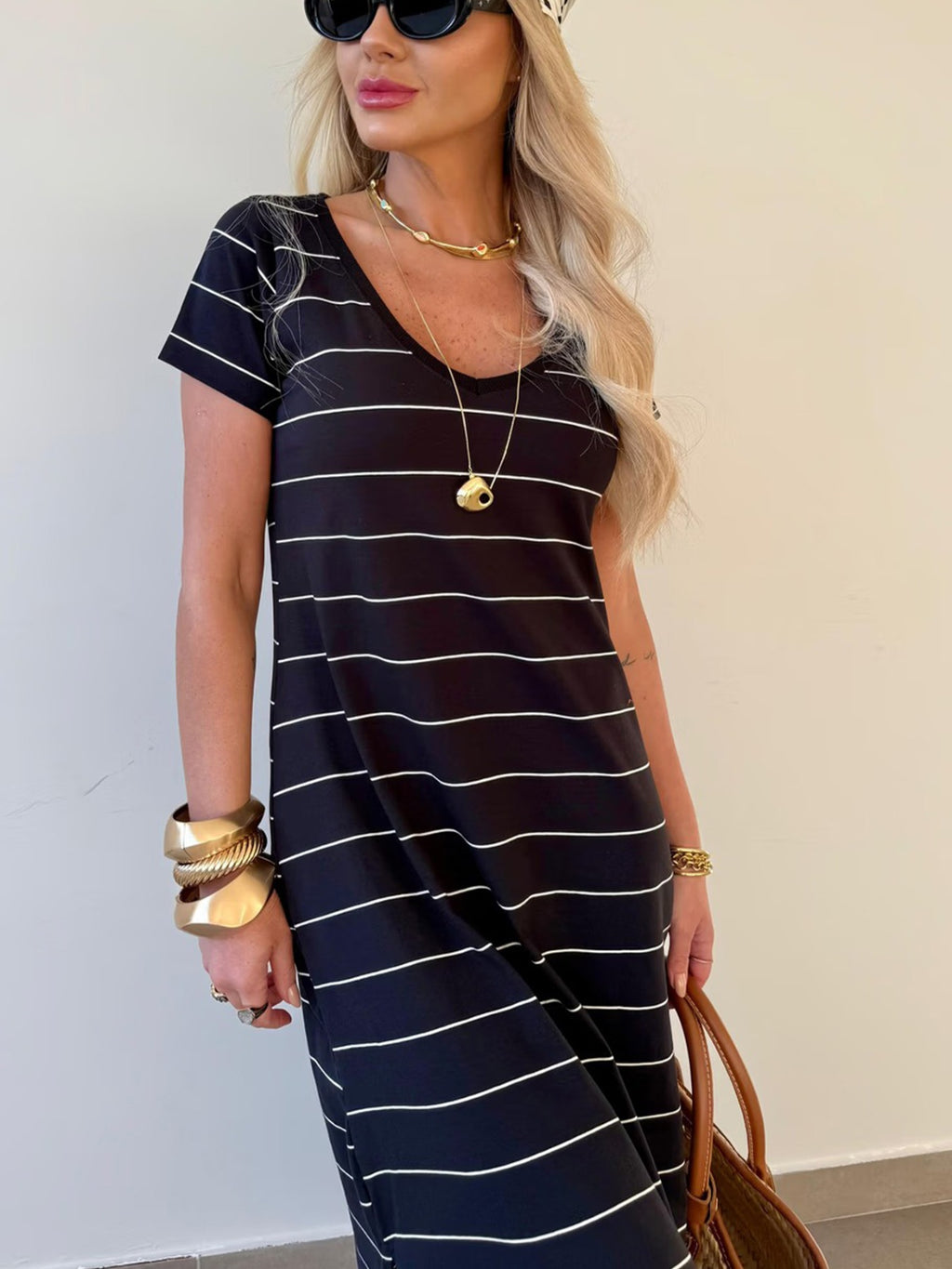 Women's striped cotton midi T-shirt dress with side slit, casual and comfortable, by Trendsi, shown in a relaxed fit.