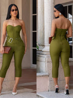 Black belted tube skinny jumpsuit by Trendsi featuring a fitted silhouette and sleeveless design, shown on a model.