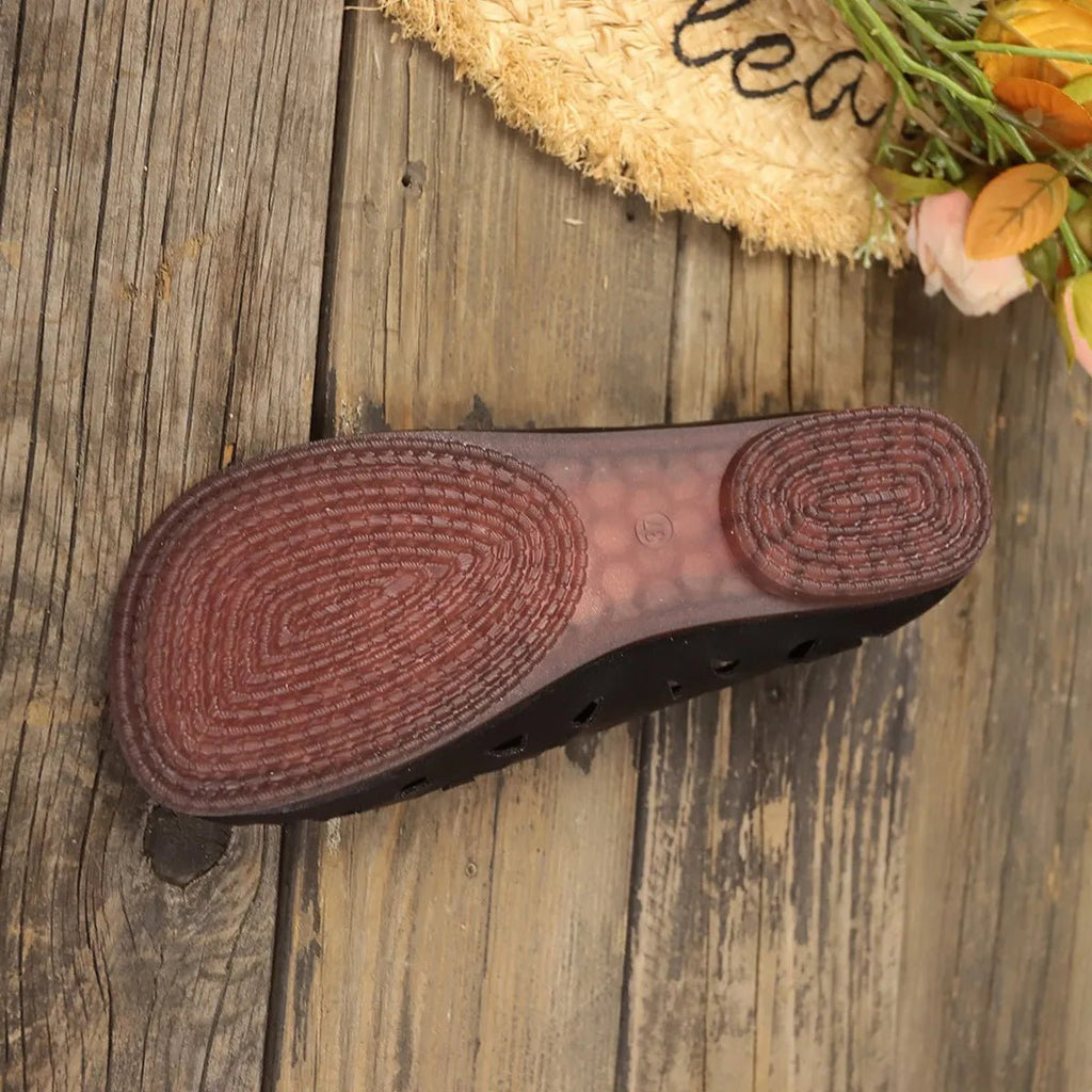 Women's hollow-out breathable casual flat slip-on shoes by Trendsi, featuring lightweight comfort and stylish open design.
