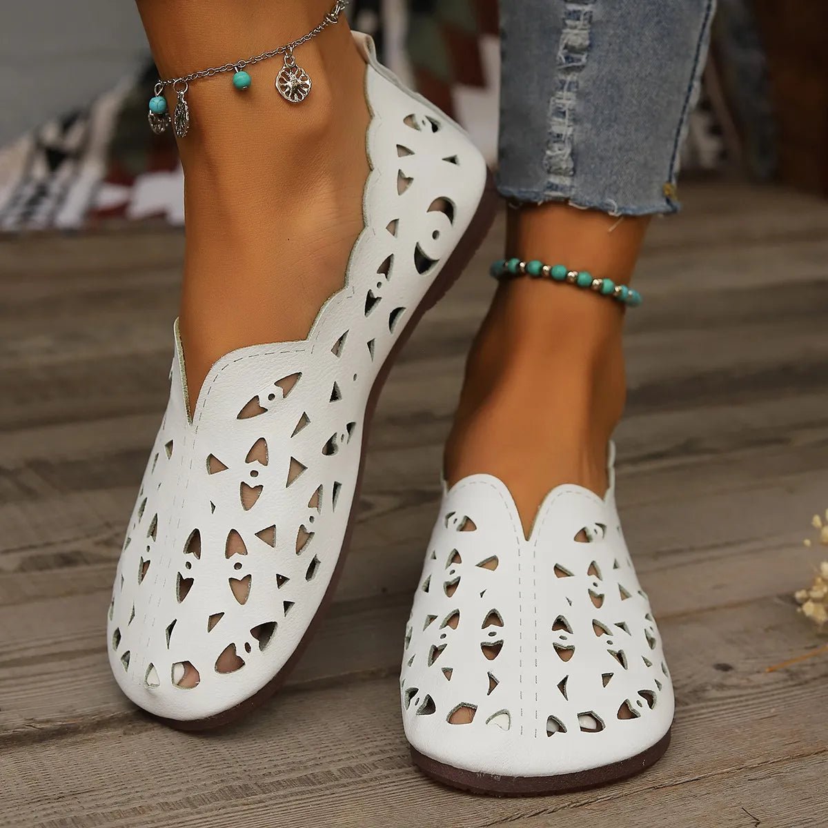 Women's hollow-out breathable casual flat slip-on shoes by Trendsi, featuring lightweight comfort and stylish open design.
