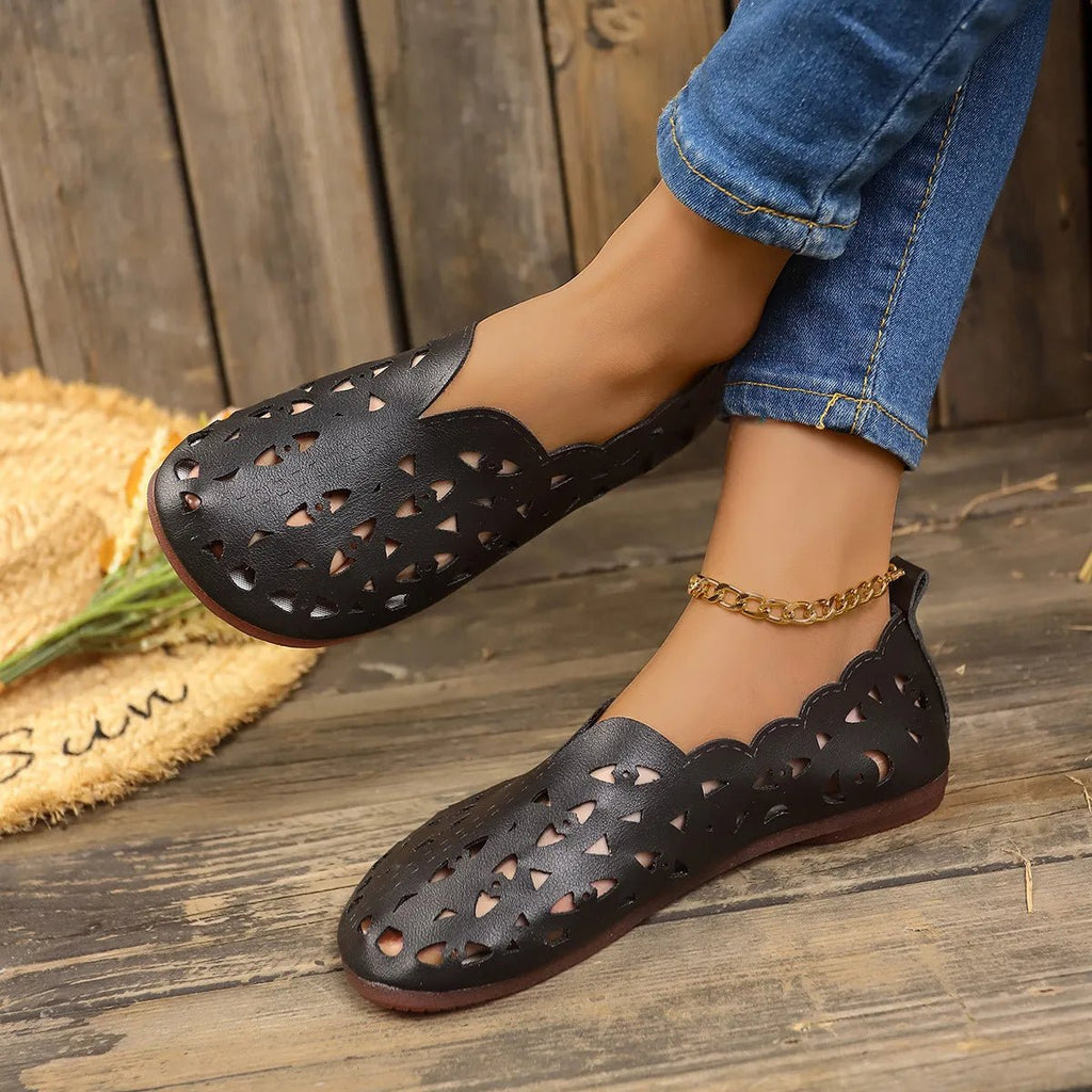 Women's hollow-out breathable casual flat slip-on shoes by Trendsi, lightweight and comfortable for everyday wear.