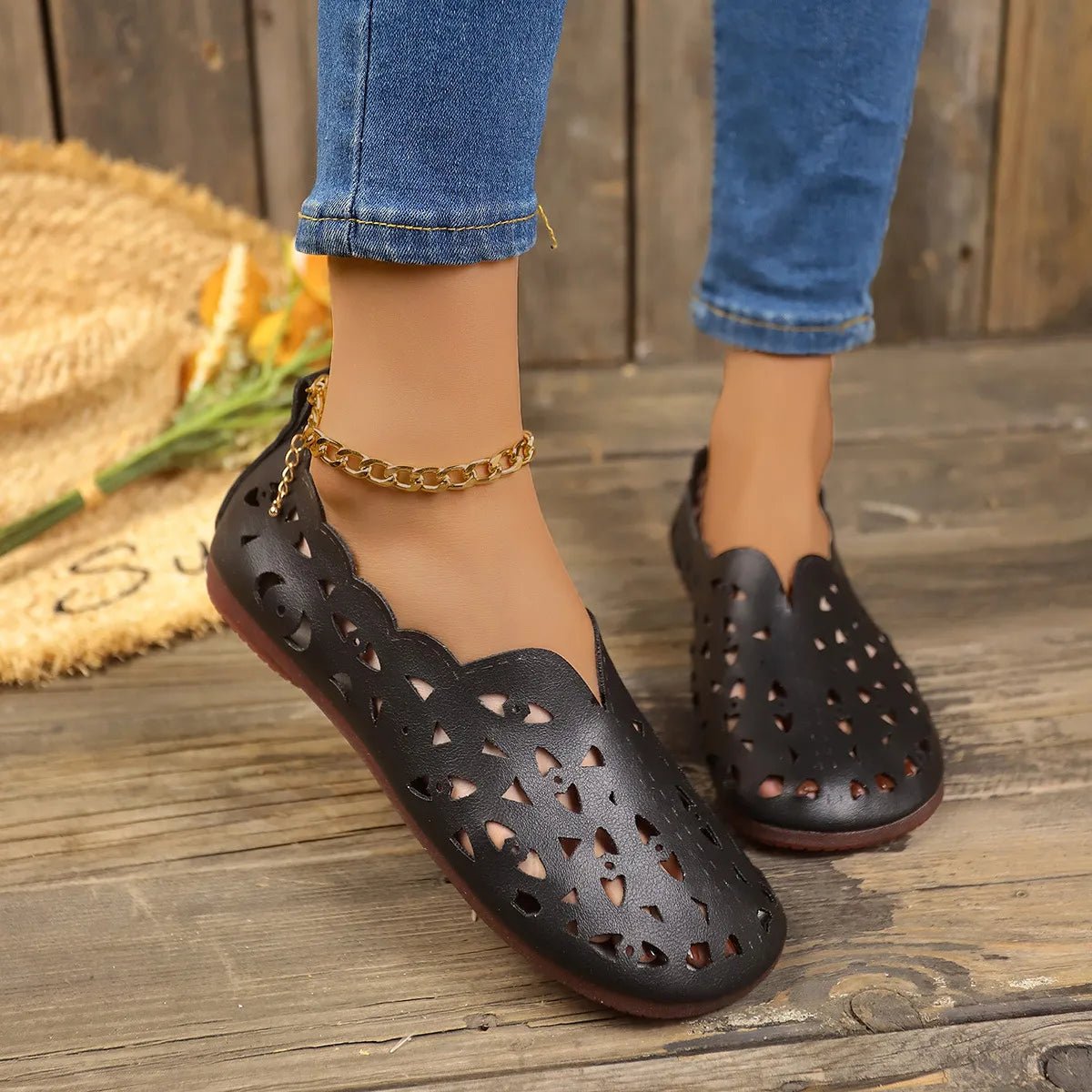Women's hollow-out breathable casual flat slip-on shoes by Trendsi, featuring lightweight comfort and stylish open design.