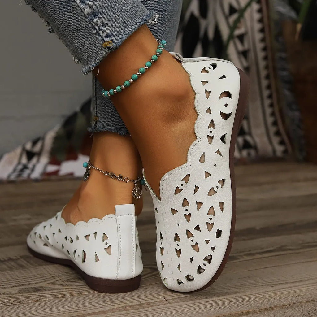 Women's breathable hollow-out casual flat slip-on shoes by Trendsi, featuring lightweight comfort and stylish design for everyday wear.