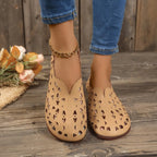 Women's hollow-out breathable casual flat slip-on shoes from Trendsi, featuring lightweight comfort and stylish open design.