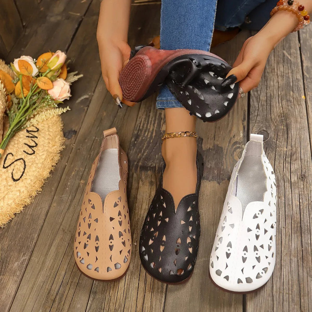 Women's hollow-out breathable casual flat slip-on shoes by Trendsi, lightweight and comfortable for everyday wear.