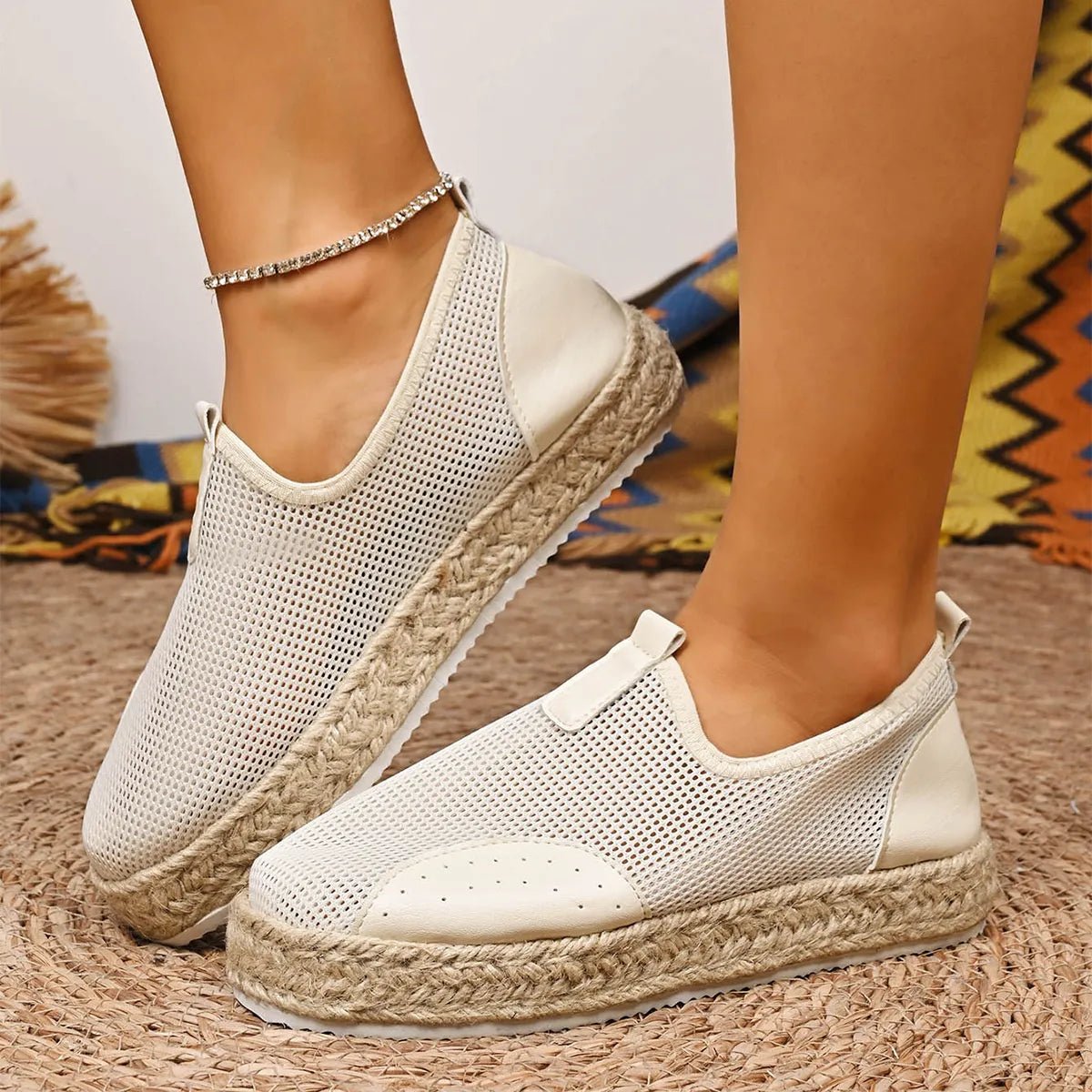 Women's breathable mesh espadrille platform slip-on flats with woven jute sole and casual slip-on design.