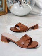 Women's open-toe block heel sandals with faux leather straps, stylish and comfortable footwear by Trendsi.