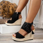 Bohemian tan peep toe lace-up wedge sandals with tassel details, stylish summer footwear from Trendsi.