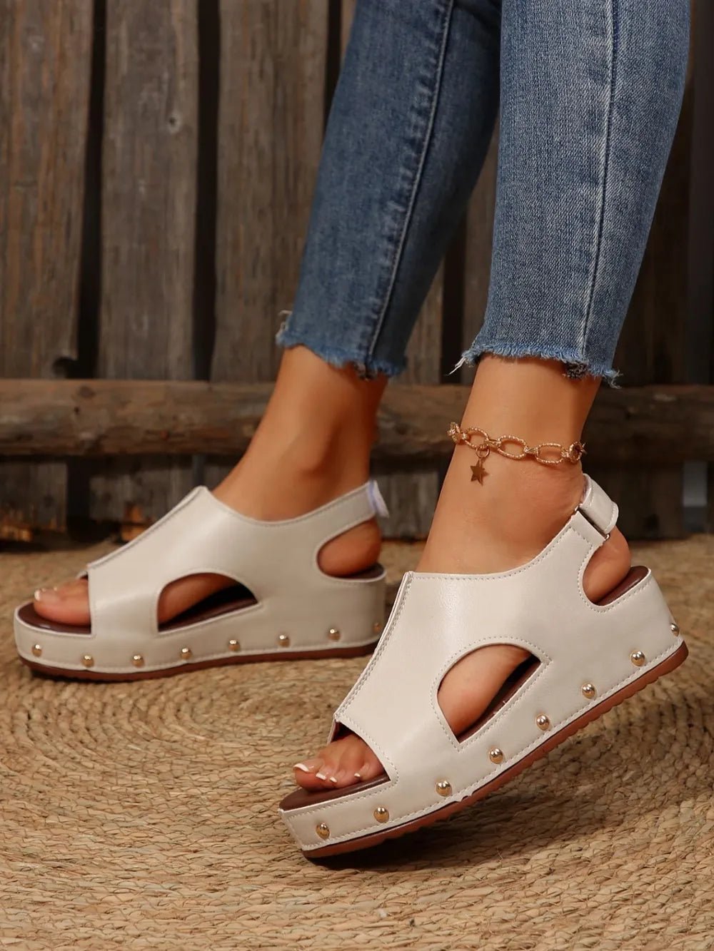 Women's studded PU leather wedge sandals with ankle straps and comfortable casual design in a trendy summer shoe style.