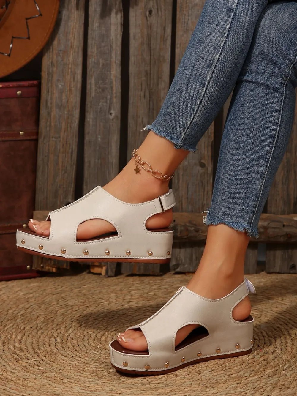 Women's studded PU leather wedge sandals with ankle straps and chunky heels, perfect for casual summer outfits.
